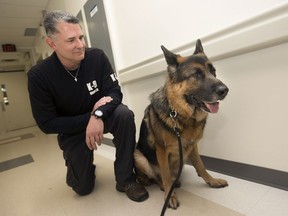 Nick Howchuk, a K9 handler with K-9 Development, poses with Jack, a drug-detecting German shepherd, at Windsor Regional Hospital - Ouellette Campus on Nov. 14, 2017.