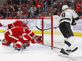 Los Angeles Kings left wing Adrian Kempe (9) scores on Detroit Red Wings goalie Jimmy Howard (35) in the third period of an NHL hockey game Tuesday, Nov. 28, 2017, in Detroit.