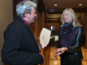 Canadian Olympian Silken Laumann signs an oar that Jim Adam brought to the Caboto Club, Nov. 11, 2017, where the Canadian Sports Hall of Fame rower spoke on mental health awareness as part of a Stigma Enigma fundraiser for Maryvale.