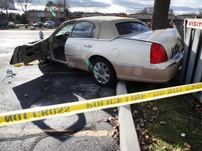 Police investigate at the scene of an accident on Lauzon Road near Tranby Avenue.