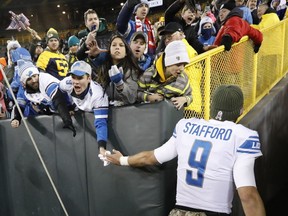 Detroit Lions' Matthew Stafford shakes hands with fans after beating the Green Bay Packers 30-17 on Nov. 6, 2017, in Green Bay.