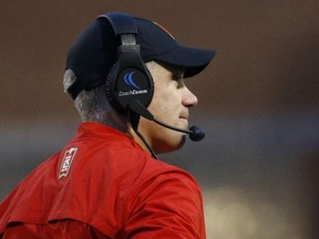 In this Saturday, Nov. 11, 2017, photo, Maryland head coach DJ Durkin stands on the field during the first half of an NCAA college football game against Michigan in College Park, Md. Maryland needs two more wins to become bowl eligible, which means it's going to take an improbable sweep of No. 22 Michigan State and Penn State to get it done.