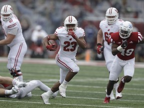 In this Nov. 4, 2017, photo, Wisconsin running back Jonathan Taylor (23) runs in the first half of an NCAA college football game against Indiana in Bloomington, Ind. No. 5 Wisconsin will face its sternest test yet this season when No. 19 Michigan visits Camp Randall Stadium in the home season finale.