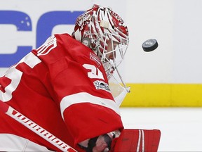 Detroit Red Wings goalie Jimmy Howard stops a Buffalo Sabres shot during the first period of an NHL hockey game Friday, Nov. 17, 2017, in Detroit. (AP Photo/Paul Sancya)