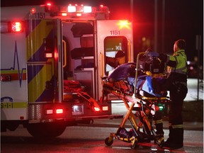 Paramedics load a male pedestrian who was struck by a vehicle on Tecumseh Road East near Rivard on Tuesday, November 21, 2017. Police shut down the eastbound lanes to deal with the situation.