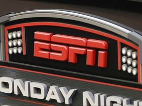 FILE - This Sept. 16, 2013, file photo shows the ESPN logo prior to an NFL football game between the Cincinnati Bengals and the Pittsburgh Steelers, in Cincinnati. ESPN says it is eliminating 150 studio and production employees as the sports broadcasting giant continues to shift its focus to a more digital future. The company says the layoffs, which were announced Wednesday morning, Nov. 29, 2017, in a memo to employees, don't include on-air talent and will have a minimal impact on the network's signature SportsCenter news program. (AP Photo/David Kohl, File)