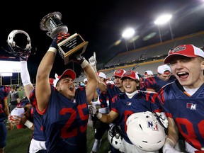 Windsor Holy Names CHS celebrates winning the Western Bowl against London South Collegiate of at Tim Horton's Field in Hamilton, Ont. on Tuesday November 28, 2017.