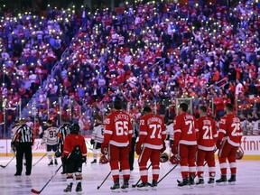 Fans light up the stands as the National Hockey League unites the community in support of cancer patients and their families before the first period of an NHL hockey game between the Detroit Red Wings and the Edmonton Oilers on Nov. 22, 2017, in Detroit.