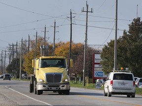 A truck rolls down North Talbot Road recently near the Eighth Concession beside an industrial park, near where Tecumseh installed a new sewer system for which some Oldcastle residents will have to help pay.