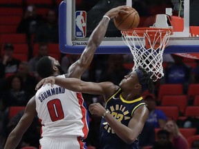 Detroit Pistons centre Andre Drummond  dunks over Indiana Pacers centre Myles Turner during the second half of an NBA basketball game, Nov. 8, 2017, in Detroit.