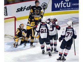 The Windsor Spitfires celebrate a goal by Tyler Angle in front of the Hamilton Bulldogs net during second-period action of Thursday's game at he WFCU Centre.