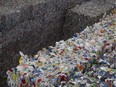 Plastic containers, steel and aluminum cans, and cartons are packaged at the Essex-Windsor Solid Waste Authority in June 2015.