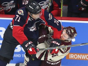 Windsor Spitfires defenceman Lev Starikov, seen last season throwing a hit on Peterborough's John Parker-Jones, was one three players on the team ranked on the NHL Central Scouting Bureau's watch list.