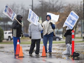 Faculty from St. Clair College walk the picket line at the main campus, Oct. 30, 2017.