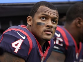 In this Sunday, Oct. 15, 2017, photo, Houston Texans quarterback Deshaun Watson sits on the sideline during an NFL football game against the Cleveland Browns in Houston.
