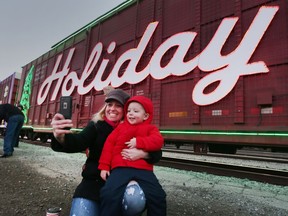 The CP Holiday Train rolled into Windsor on Thursday, Nov. 30, 2017, and was greeted by hundreds of people. Crystal Allison and her son Cole, 2, take a selfie in front of the train.