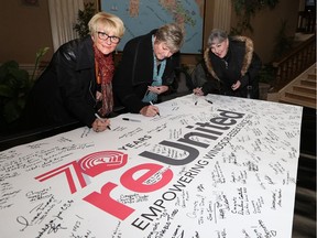 Attendees sign a banner during the United Way Centraide Windsor-Essex County's 70th anniversary ReUnited gathering at the Caboto Club, Nov. 10, 2017. The event was held to celebrate the United Way and the community and it's support.