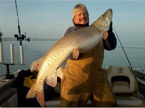Brian Denomme holds one of the many muskies he's caught while fishing in Lake St. Clair.