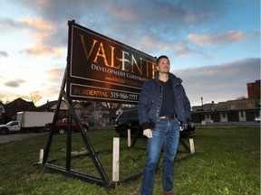 Peter Valente stands on Ouellette Avenue just north of Erie Street, the site of his company's planned 32-unit residential building.