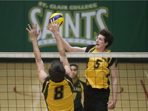 Ryan Acott, right, gets the ball over the net as the St. Clair Saints men's volleyball team practises at the SportsPlex, Wednesday, Nov. 1, 2017.  (DAX MELMER/Windsor Star)
Dax Melmer, Windsor Star