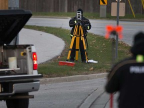 Windsor police traffic collision specialists examine the scene of an overnight crash on McHugh Street near the WFCU Centre on the morning of Nov. 20, 2017.