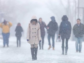 University of Windsor students make their way on campus during a snowstorm in March 2017.