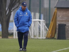 Italy coach Gian Piero Ventura walks on the pitch during a training session in Appiano Gentile, near Milan, Italy, on Nov. 12, 2017.