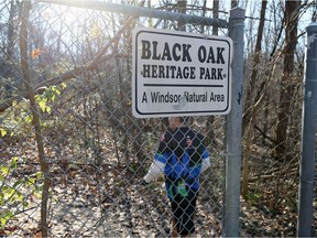 A runner passes through a fence opening at Black Oak Heritage Park on Dec. 03, 2017.