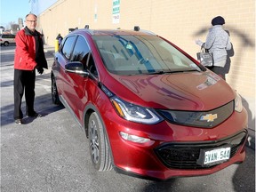 Bob Aylesworth with his new Chevy Bolt EV at the Windsor International Aquatic and Training Centre Dec. 8, 2017.