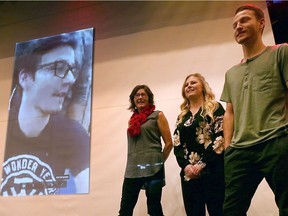 Students at Cardinal Carter Catholic Secondary School in Leamington donated $1,000 on Thursday, December 21, 2017, toward the medical bills of former graduate Shawn Florence who was recently paralyzed in a skiing accident in Michigan. Every year the school holds a cake auction and chooses someone in the community who is in need of assistance. Rosemary Cobby, left, Shawn's mother, Lydia Sanderson, Shawn's girlfriend and Scott Florence, brother, are shown on stage at the school where they had a brief live video feed with him from his hospital bed in London.