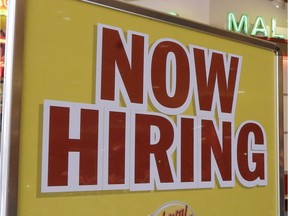 A file photo of a restaurant's "Now Hiring" sign.