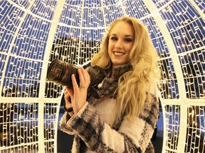 Emma Amlin of Blush Photography is shown Dec. 16, 2017, at Bright Lights Windsor in Jackson Park, where both professional and amateur shutterbugs are capturing magical moments.
