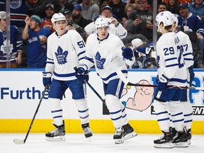 Auston Matthews (middle) celebrates his goal against the Oilers on Thursday night with Jake Gardiner and William Nylander (Photo by Codie McLachlan/Getty Images)