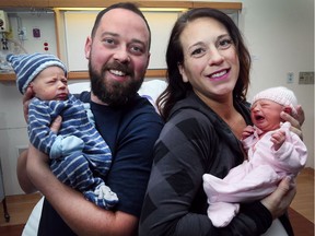 Scott McMullan and Morgan Malewicz pose with their newborn babies Clark, left, and Roslyn at the Windsor Regional Hospital Met Campus on Dec. 18, 2017.
