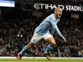 Manchester City's David Silva celebrates scoring his side's second goal during the English Premier League soccer match against West Ham United at the Etihad Stadium, Manchester, England, Sunday Dec. 3, 2017.