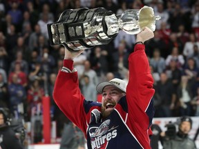 Aaron Luchuk of the Windsor Spitfires lifts the Memorial Cup trophy on Sunday, May 28, 2017, at the WFCU Centre in Windsor after defeating the Erie Otters.