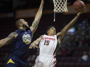 Windsor's Chad Frazier, at right, is seen in action earlier this season. He had 26 points to lead the Express to a win on Saturday.