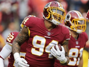 Washington Redskins outside linebacker Preston Smith (94) celebrates after recovering a fumble by Arizona Cardinals quarterback Blaine Gabbert during the first half of an NFL football game in Landover, Md., Sunday, Dec 17, 2017.