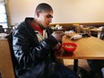 Ali Abdullah, 26, stops in the Street Help organization for a bowl of soup on a freezing cold Friday, Dec. 29, 2017. The recently homeless man also occasionally sleeps at the Wyandotte Street East location.