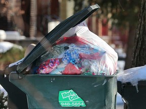 Holiday season garbage overflows a Herby Curby container on Lincoln Road in Windsor on Dec. 28, 2017.