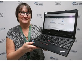 Judy Allen, manager of healthy schools for the Windsor-Essex County Health Unit displays the home page for a new online immunization reporting system that is now available.