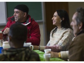 Durre Jabeen, centre, takes part in the Let's Talk English session at the central branch of the Windsor Public Library on Dec. 13, 2017.