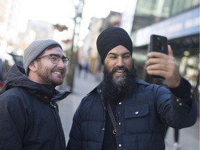 Federal NDP leader Jagmeet Singh takes a selfie with downtown resident Joey Acott while taking a tour of Windsor, Friday, Dec. 1, 2017.