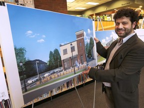 The Windsor Public Library hosted an open house on Wednesday, May 10, 2017, for its new John Muir branch scheduled to open in the former Sandwich Fire Hall. The event was held at the at the current Sandwich branch. Jason Grossi, the architect who designed the renovations poses with a rendering of the new branch.