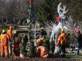 Workers perform set up work for the Bright Lights Windsor display at the Jackson Park in Windsor on Dec. 8, 2017.