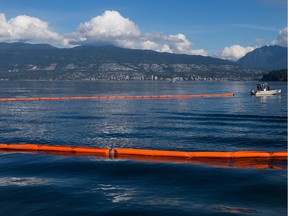 A spill response boat pulls a boom during a Western Canada Marine Response Corporation (WCMRC) Transport Canada spill response exercise on English Bay in Vancouver, B.C., on Sept. 22, 2015.