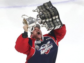 Windsor Spitfires goaltender Michael DiPietro holds up the Memorial Cup after the Spitfires defeated the Erie Otters to win the Memorial Cup final at the WFCU Centre in Windsor, Ontario on May 28, 2017.
