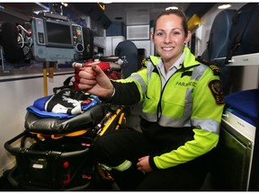 Essex-Windsor EMS paramedic Stacey Shepley displays a vile of Naloxone that is among supplies carried in all ambulances.