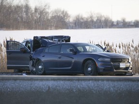 OPP officers investigate after a Dec. 23, 2017, collision involving an OPP cruiser sent an officer to hospital on Highway 401 eastbound, west of Tilbury.
