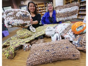 Sophan Buffa, left, and Gail Marlow display pillows and mats that were crocheted from plastic bags on November 28, 2017, at General Brock School in Windsor.